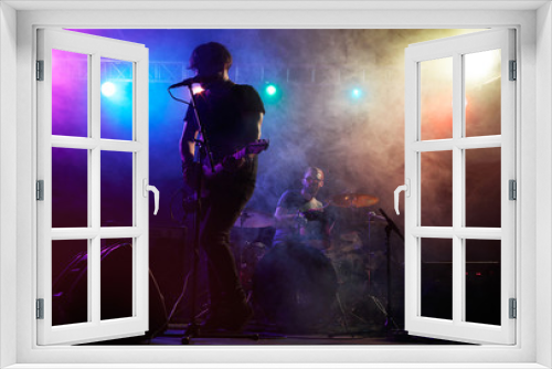Fototapeta Naklejka Na Ścianę Okno 3D - Silhouette of guitar player on stage.