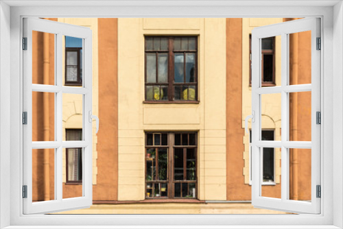 Fototapeta Naklejka Na Ścianę Okno 3D - Several windows in a row on facade of urban apartment building front view, St. Petersburg, Russia.