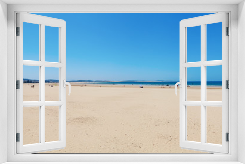 Fototapeta Naklejka Na Ścianę Okno 3D - Clear blue sky over emerald sea and yellow sandy beach, Agadir, Morocco