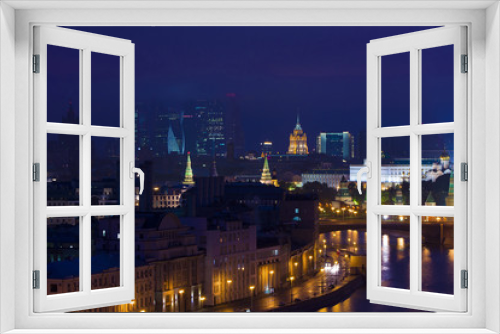 Fototapeta Naklejka Na Ścianę Okno 3D - The view of the city from a tall building