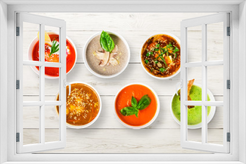 Fototapeta Naklejka Na Ścianę Okno 3D - Variety of soups at white wood, top view