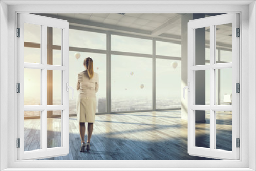 Businesswoman in modern office interior   . Mixed media