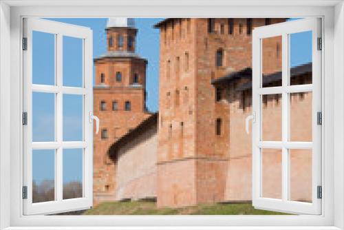 Fototapeta Naklejka Na Ścianę Okno 3D - Two ancient towers in the Novgorod fortress close up, sunny april day. Veliky Novgorod, Russia