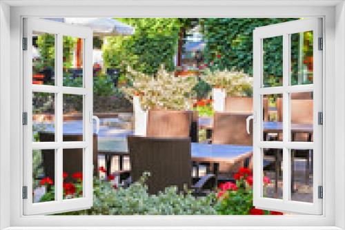 Fototapeta Naklejka Na Ścianę Okno 3D - summer street cafe interior in green city park, ornate with flowers and decorative elements, white umbrella