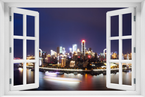 cityscape and skyline of downtown near water of chongqing night