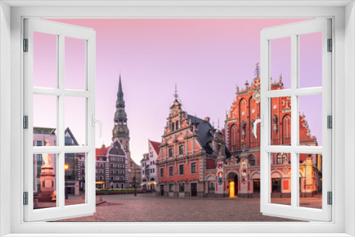 Fototapeta Naklejka Na Ścianę Okno 3D - City Hall Square with House of the Blackheads and Saint Peter church in Riga Old Town During sunset time.