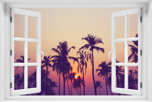 Fototapeta Naklejka Na Ścianę Okno 3D - Silhouette of palm trees at sunset, vintage filter