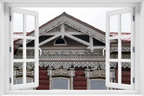 Fototapeta Naklejka Na Ścianę Okno 3D - The windows with beautiful architraves in old wooden house. Ulan