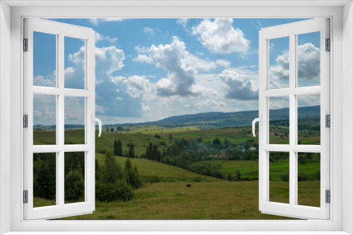 Fototapeta Naklejka Na Ścianę Okno 3D - Summer day landscape with cloudy sky, mountains, small houses. Carpathian Mountains. Ukraine. Europe.