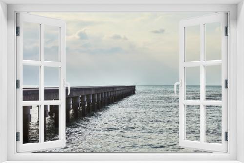 Fototapeta Naklejka Na Ścianę Okno 3D -  wooden pier with sun rays over sea