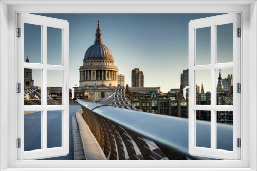 Fototapeta Naklejka Na Ścianę Okno 3D - St Paul’s cathedral dome and the rail from the Millennium bridge, early in the morning twilight in London, England, UK. Saint Paul Cathedral is an Anglican church