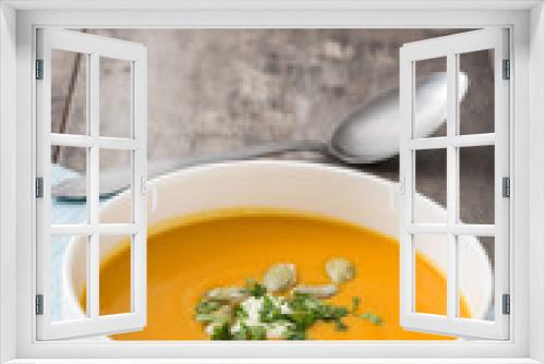 Fototapeta Naklejka Na Ścianę Okno 3D - Pumpkin soup and pumpkin seeds on rustic wooden background

