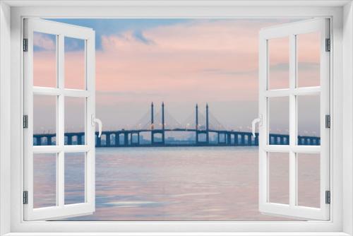 Fototapeta Naklejka Na Ścianę Okno 3D - Sunrise by the shore with view of Penang Bridge