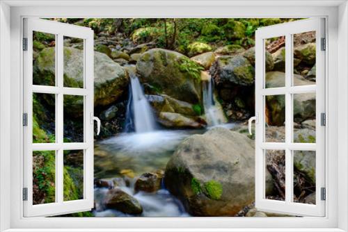 Fototapeta Naklejka Na Ścianę Okno 3D - Attractive Waterfall and Green Moss Stone In Forest