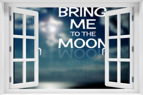 Bring me to the moon.  Lettering  on a  blurred background.