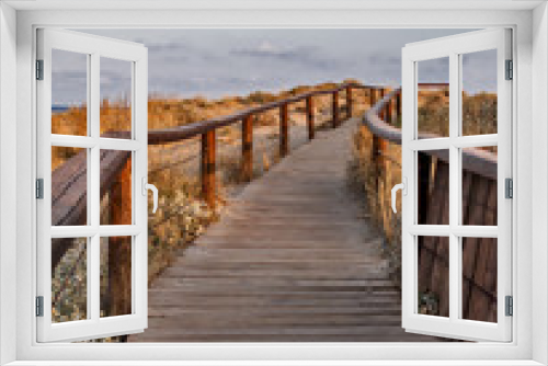 Fototapeta Naklejka Na Ścianę Okno 3D - Wooden path at summer coast landscape