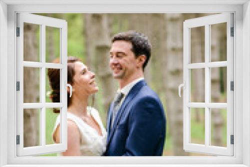 Bride and Groom at wedding Day walking Outdoors on spring nature. Bridal couple, Happy Newlywed woman and man embracing in green park. Loving wedding couple outdoor.