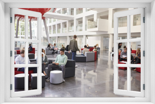 Students socialising in the lobby of modern university