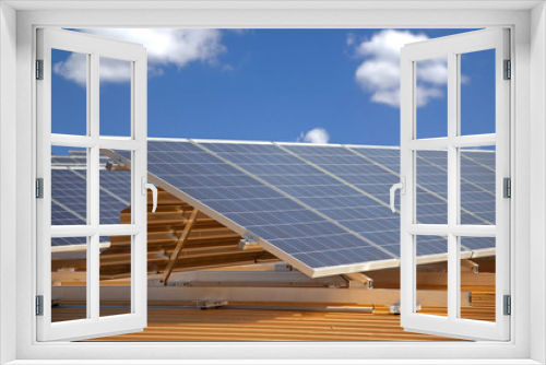 Fototapeta Naklejka Na Ścianę Okno 3D - solar panels on roof against blue sky