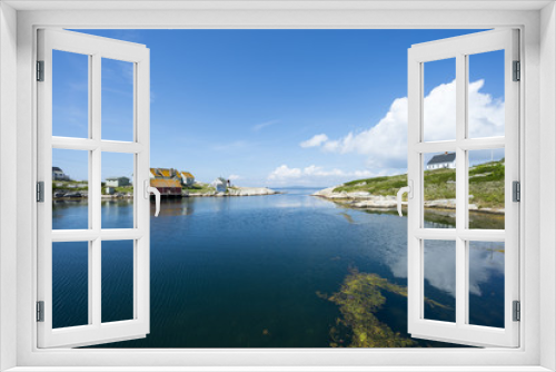 Fototapeta Naklejka Na Ścianę Okno 3D - Scenic landscape view of the calm waters of the harbour in the fishing village of Peggy's Cove, in Halifax, Nova Scotia, Canada