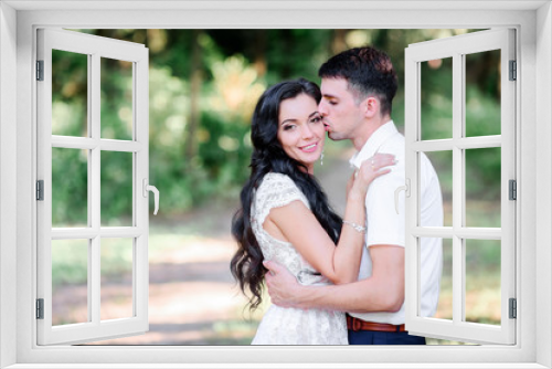 Beautiful luxury newlyweds posing outside