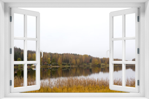 Fototapeta Naklejka Na Ścianę Okno 3D - A view during autumn day on the lake.