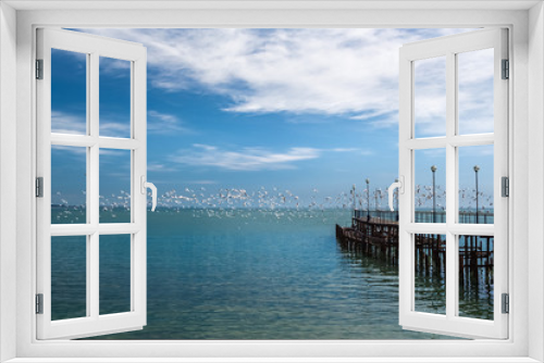 Fototapeta Naklejka Na Ścianę Okno 3D - Old pier and seagulls over the sea