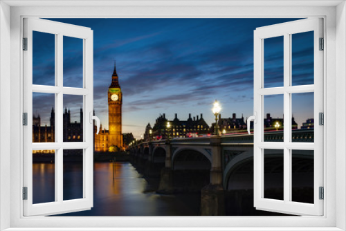 Fototapeta Naklejka Na Ścianę Okno 3D - Big Ben and the Houses of Parliament at night from across the river Thames and Westminster bridge southbank in London, England, UK