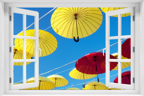 Fototapeta Naklejka Na Ścianę Okno 3D - colorful umbrellas under the beautiful cloudy sky. 