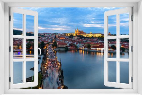 Fototapeta Naklejka Na Ścianę Okno 3D - Panorama of Prague with red roofs and Charles bridge from above at dusk, Czech Republic, Europe