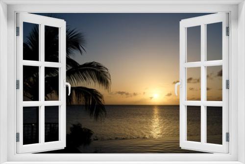 Fototapeta Naklejka Na Ścianę Okno 3D - Sunset over infinity pool and Cocobay beach