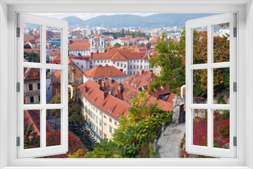 Fototapeta Naklejka Na Ścianę Okno 3D - View of the old town center of Graz from the staircase of Schlossberg Hill. Graz, Austria.