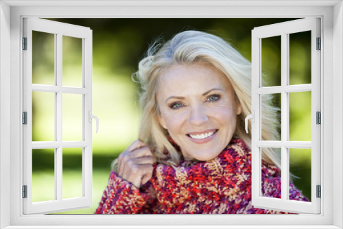 Portrait Of A Mature Woman Smiling At the Camera At The Park