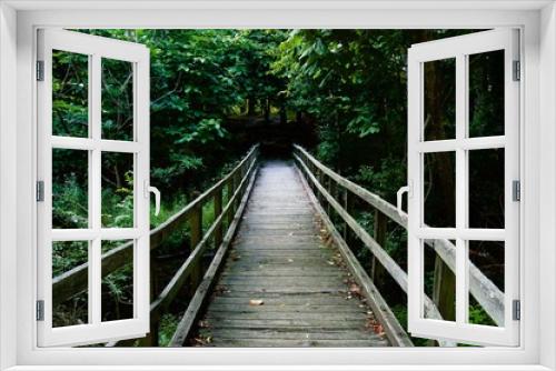 Fototapeta Naklejka Na Ścianę Okno 3D - Wooden Bridge Leading into the Wood