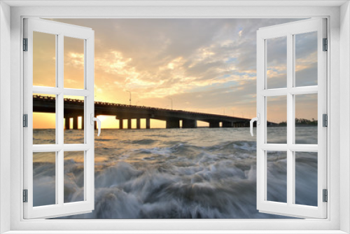 Fototapeta Naklejka Na Ścianę Okno 3D - sunset bridge over a sea