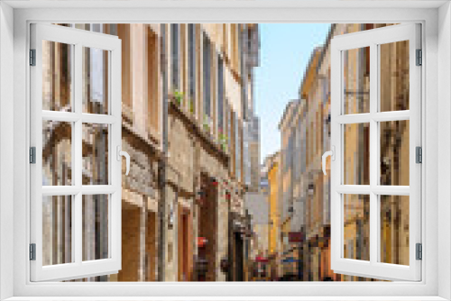 Fototapeta Naklejka Na Ścianę Okno 3D - Romantic tiny street in central Aix-En-Provence, South of France on hot summer day without pedestrians