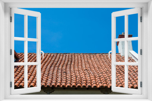 Fototapeta Naklejka Na Ścianę Okno 3D - Hand Laid Tile Roof Under Blue Sky