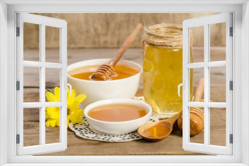 Fototapeta Naklejka Na Ścianę Okno 3D - Yellow flower, jar, bowl and spoon with honey on wooden backgrou