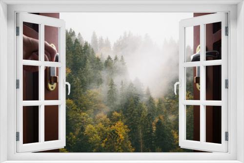 Fototapeta Naklejka Na Ścianę Okno 3D - hand opens room door to the nature