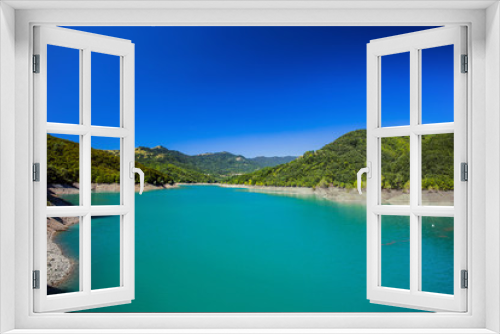 Fototapeta Naklejka Na Ścianę Okno 3D - The mountain lake with green water under a blue clear sky