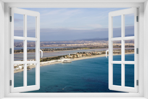 Fototapeta Naklejka Na Ścianę Okno 3D - Cagliari; panoramica della spiaggia del Poetto e dello stagno di Molentargius vista dal colle della °Sella del Diavolo - Sardegna