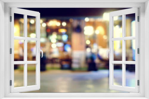 image of wooden table in front of abstract blurred background