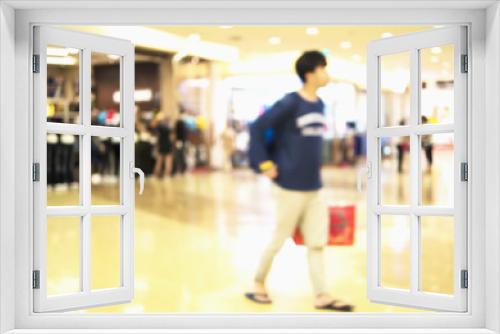 Blurred photo of a guy in a modern shopping center