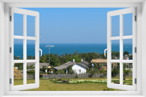 Fototapeta Naklejka Na Ścianę Okno 3D - The landscape at the Cossack village - a museum Ataman. the village and the sea view from the heights of the hill.