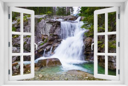 Fototapeta Naklejka Na Ścianę Okno 3D - A gorgeous mountain waterfall.
