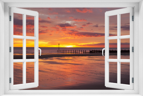 Fototapeta Naklejka Na Ścianę Okno 3D - Dawn at South Beach, Blyth, Northumberland. Showing sunrise and groynes on sandy beach.