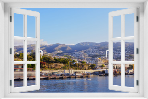 Fototapeta Naklejka Na Ścianę Okno 3D - Portugal, Madeira, Funchal, Cityscape viewed from the ferry leaving the port..