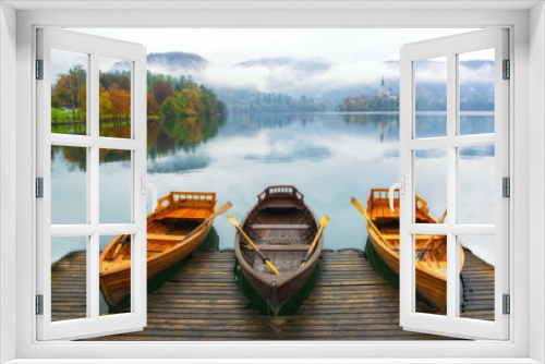 Fototapeta Naklejka Na Ścianę Okno 3D - Three boats moored on Bled lake at foggy autumn day