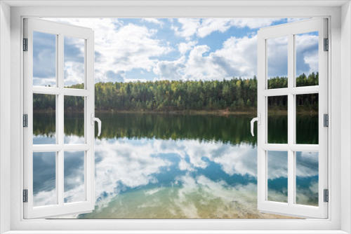 Fototapeta Naklejka Na Ścianę Okno 3D - calm lake with reflections of clouds  in summer
