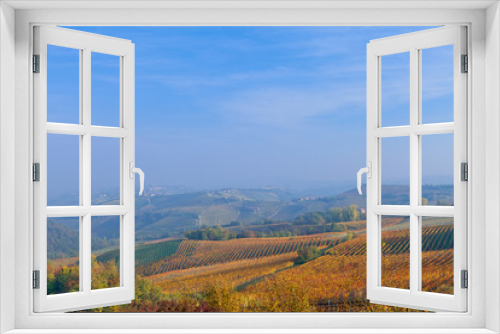 Fototapeta Naklejka Na Ścianę Okno 3D - View on vineyards and small houses on the hill in Piedmont, Italy